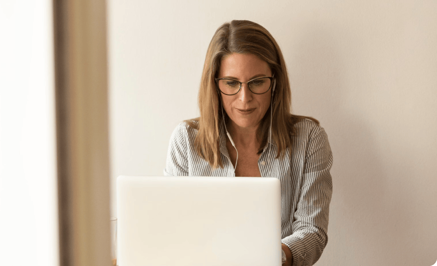 Picture of a woman looking at her laptop screen